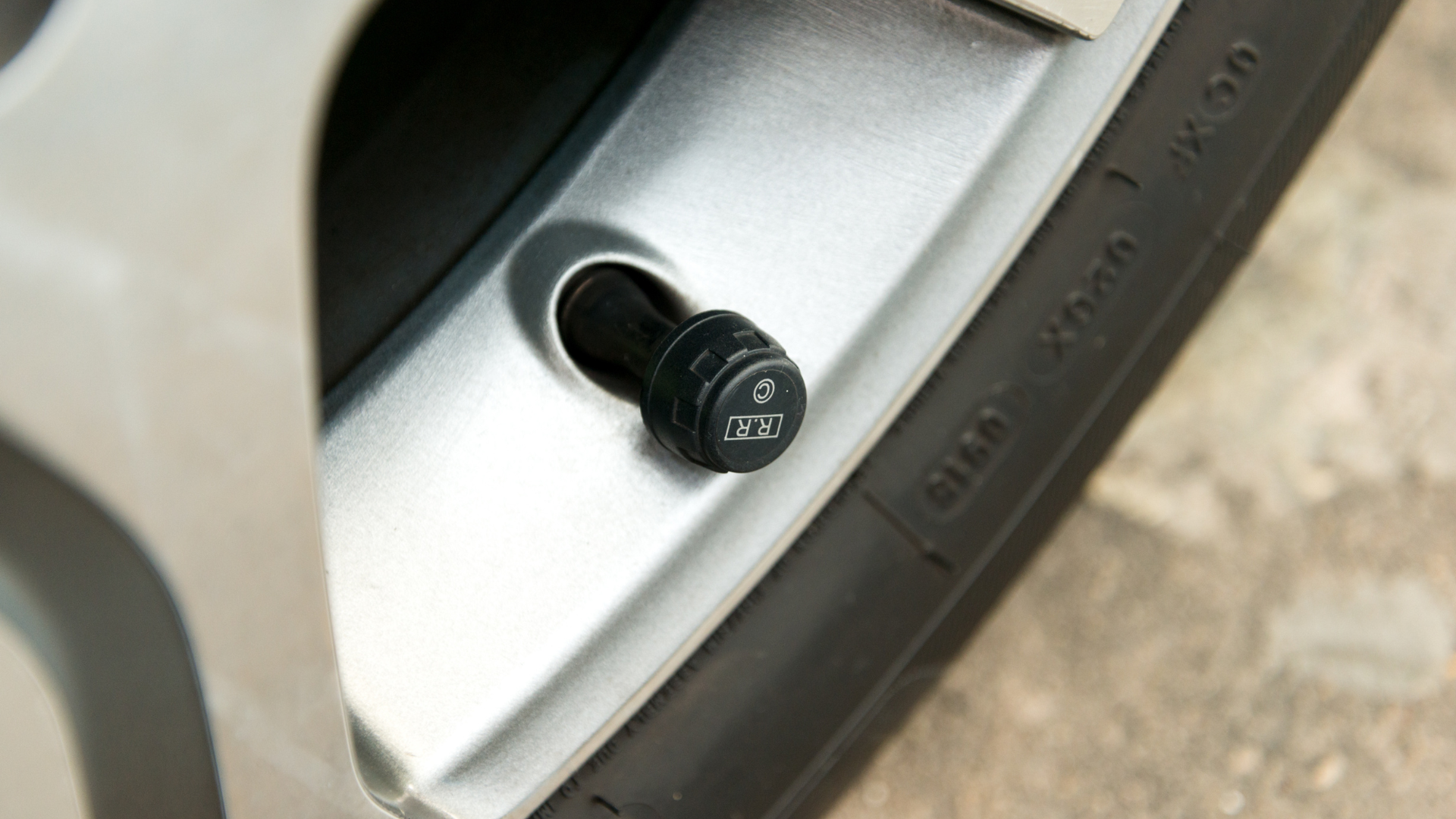 TPMS tyre pressure monitoring sensor fitted to an alloy wheel valve stem