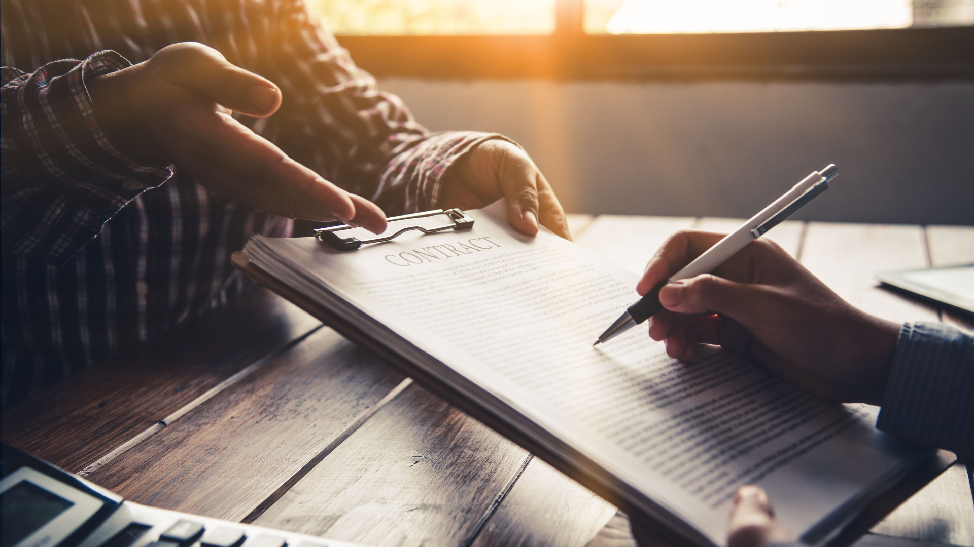 Signing a fleet service contract at a desk